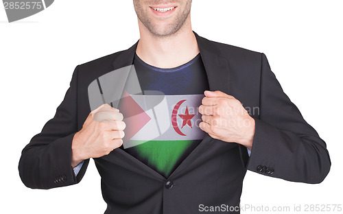 Image of Businessman opening suit to reveal shirt with flag