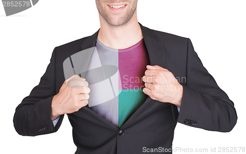 Image of Businessman opening suit to reveal shirt with flag