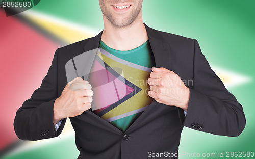 Image of Businessman opening suit to reveal shirt with flag