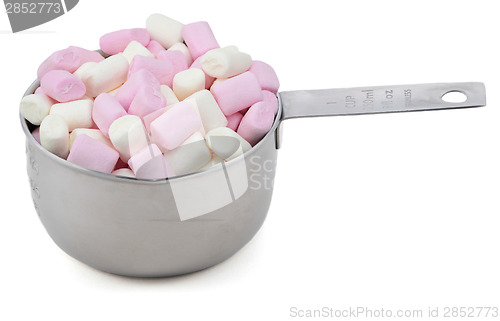 Image of Pink and white mini marshmallows in an American cup measure