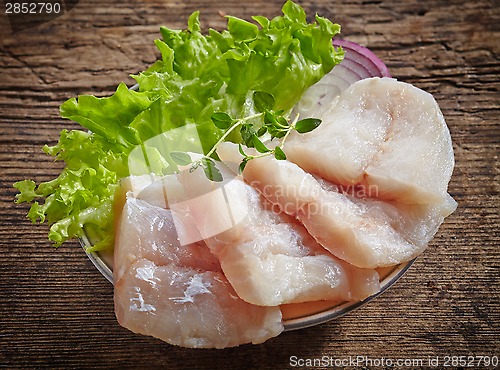 Image of raw hake fish fillet pieces