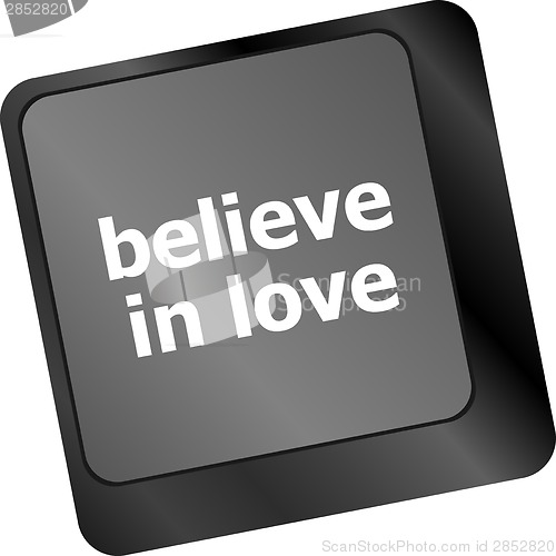 Image of keyboard key with believe in love text and arrow