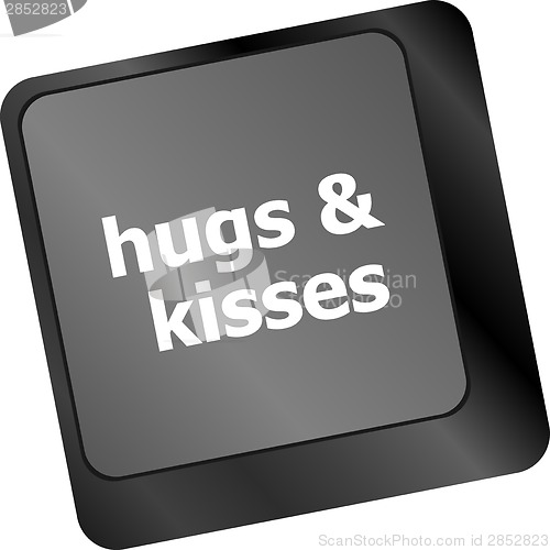 Image of hugs and kisses words on computer keyboard keys