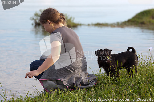 Image of Little girl and her dog