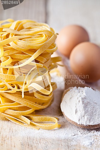 Image of italian pasta tagliatelle, flour and eggs