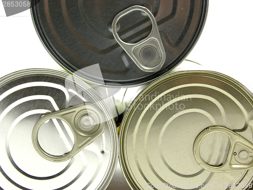 Image of Three  lying tin cans on a white background