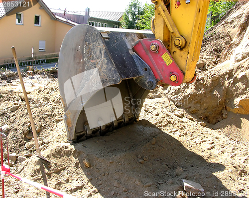 Image of Cutout with a digger shovel on a site