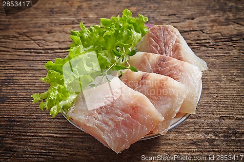 Image of raw hake fish fillet pieces