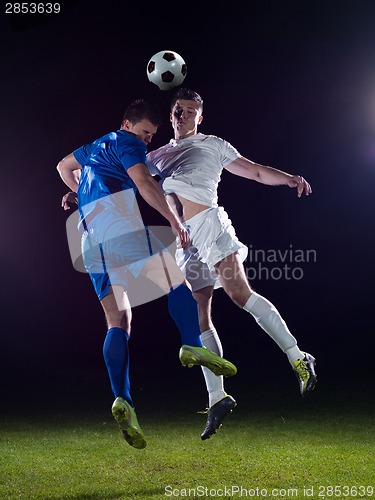 Image of soccer players duel