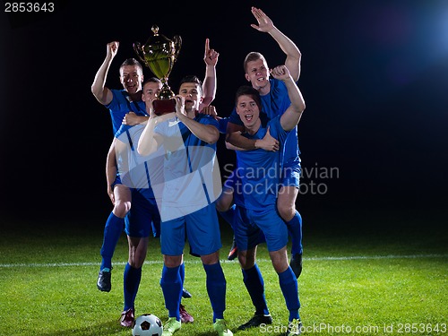 Image of soccer players celebrating victory