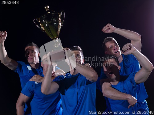 Image of soccer players celebrating victory