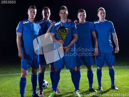 Image of soccer players celebrating victory