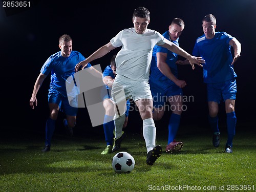 Image of soccer players duel