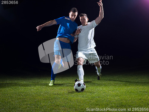 Image of soccer players duel