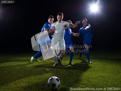 Image of soccer players duel