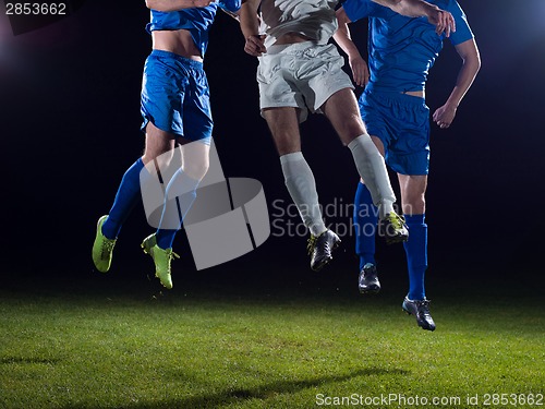 Image of soccer players duel