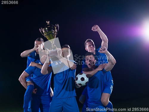 Image of soccer players celebrating victory