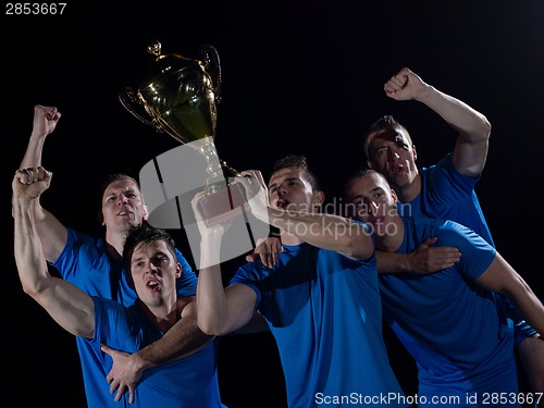 Image of soccer players celebrating victory