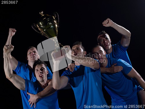 Image of soccer players celebrating victory