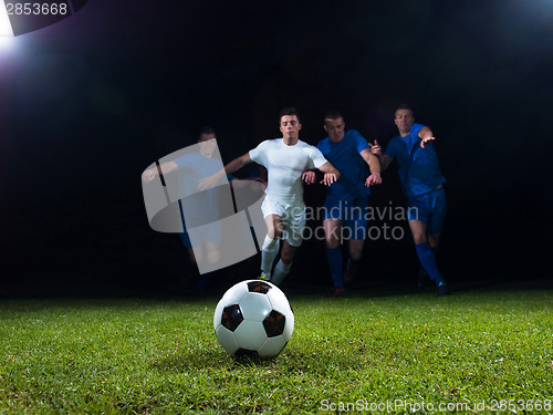 Image of soccer players duel