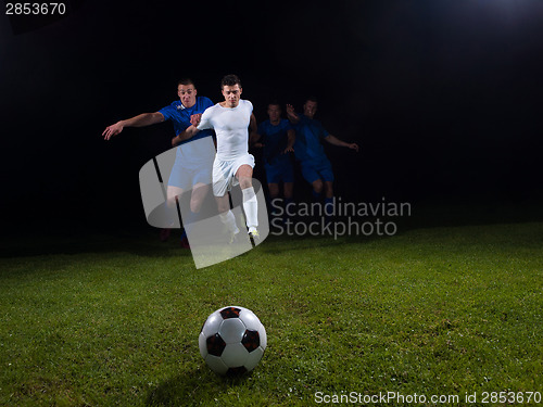 Image of soccer players duel