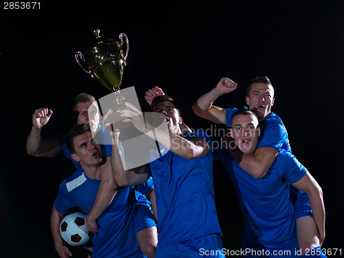 Image of soccer players celebrating victory