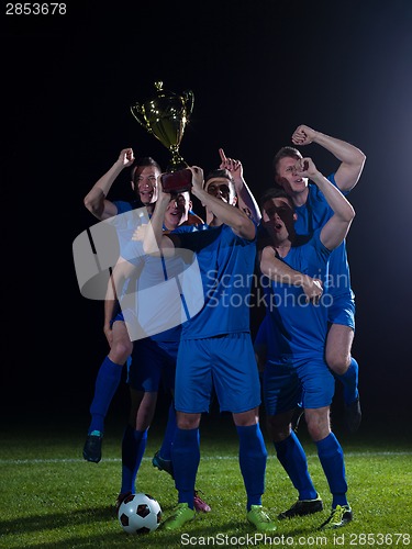 Image of soccer players celebrating victory