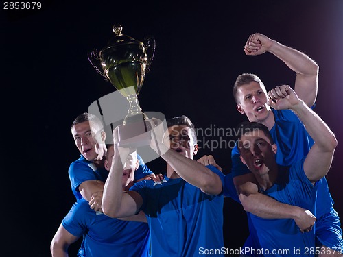 Image of soccer players celebrating victory