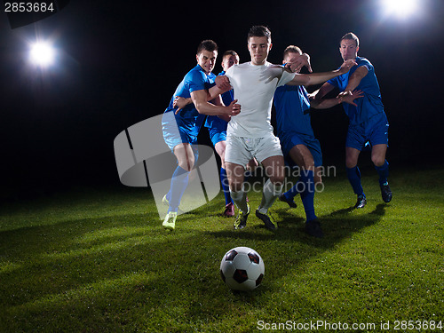 Image of soccer players duel