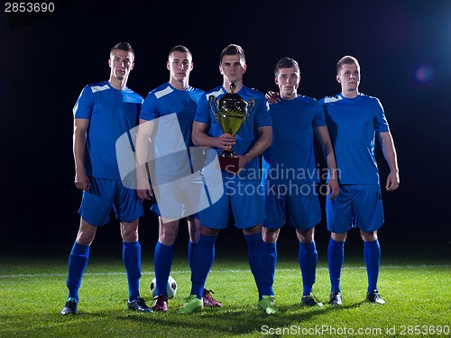 Image of soccer players celebrating victory