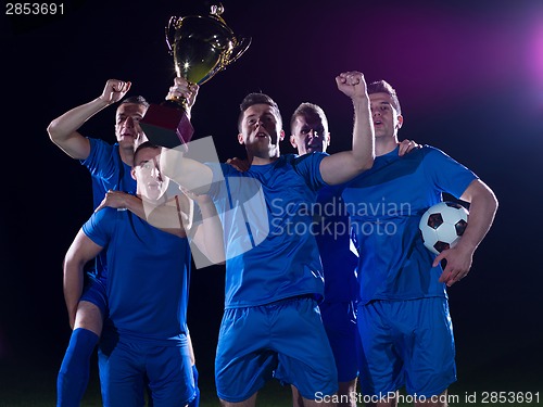 Image of soccer players celebrating victory