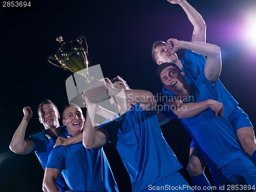 Image of soccer players celebrating victory