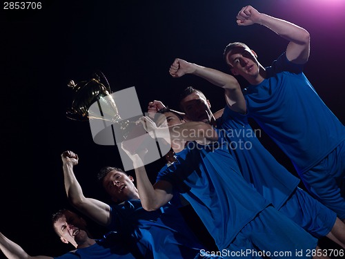 Image of soccer players celebrating victory