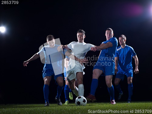 Image of soccer players duel