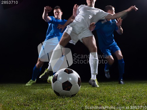 Image of soccer players duel