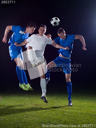 Image of soccer players duel