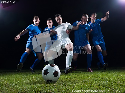 Image of soccer players duel