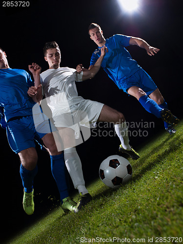 Image of soccer players duel