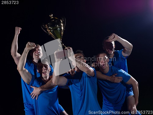 Image of soccer players celebrating victory