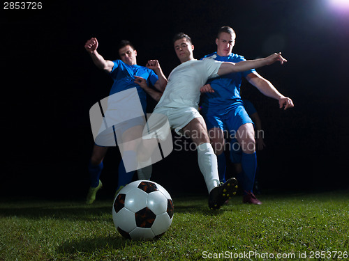 Image of soccer players duel