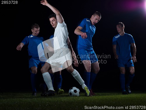 Image of soccer players duel