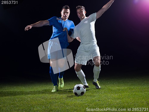 Image of soccer players duel