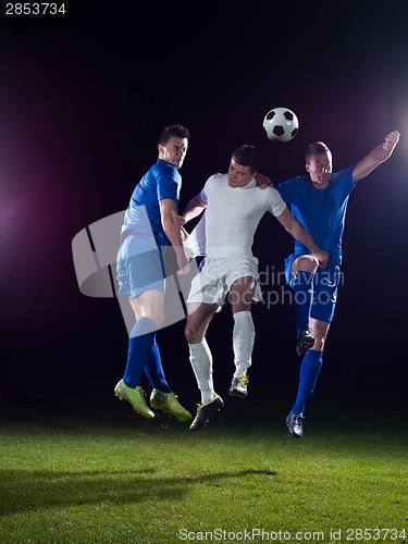 Image of soccer players duel