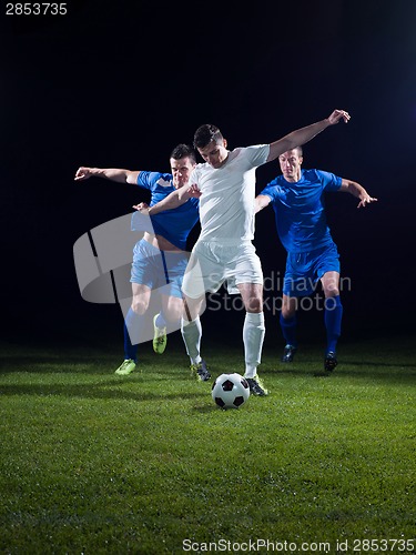 Image of soccer players duel