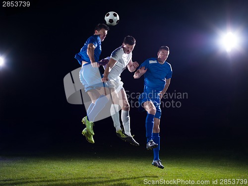 Image of soccer players duel