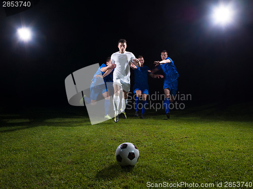 Image of soccer players duel