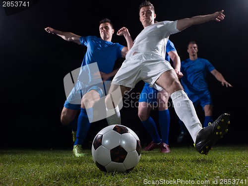 Image of soccer players duel