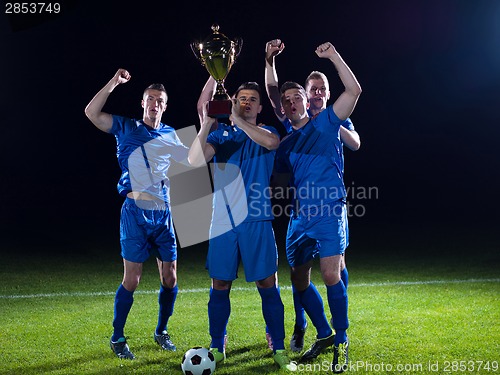 Image of soccer players celebrating victory