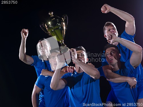 Image of soccer players celebrating victory