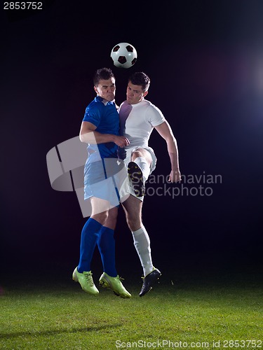 Image of soccer players duel